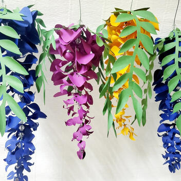 Vibrant Handmade Paper Wisteria Garland, featuring 12 flowers in assorted lengths of 20cm and 30cm, ideal for wedding and garden party decorations, or as a permanent home decor piece
