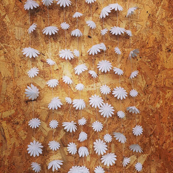 Handcrafted white pearl paper garland, featuring flowers in 10cm, 8cm, and 4cm diameters, ideal for adding a touch of sophistication to shop displays or as exquisite wedding decor.